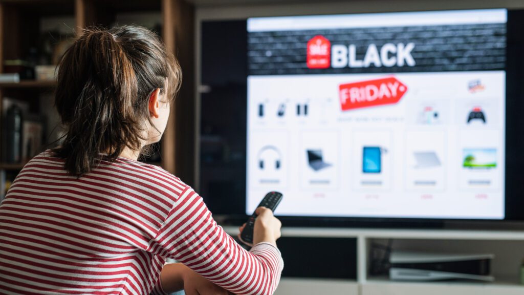 A woman interacts with a CTV ad