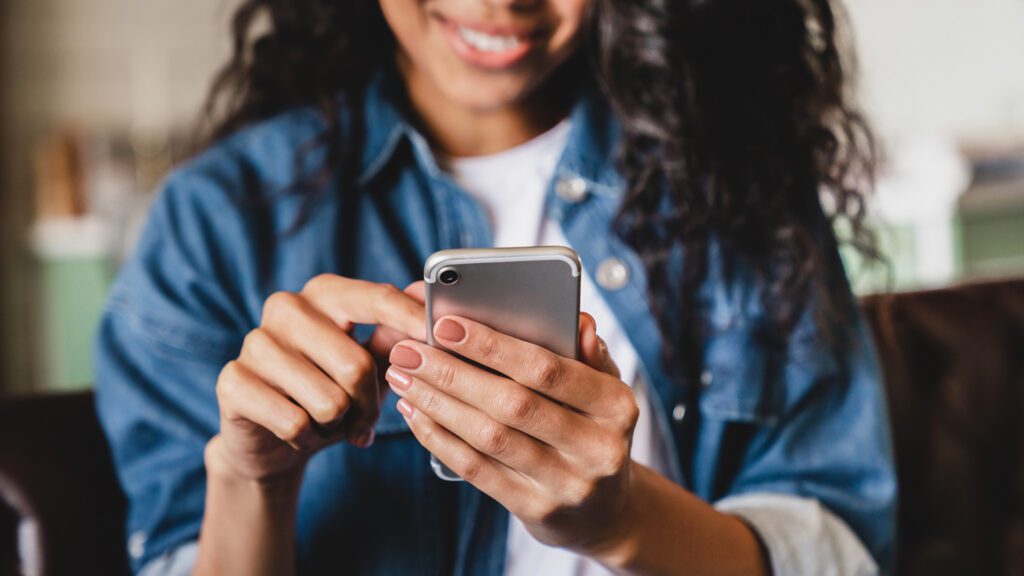 A woman interacts with Meta products on her phone